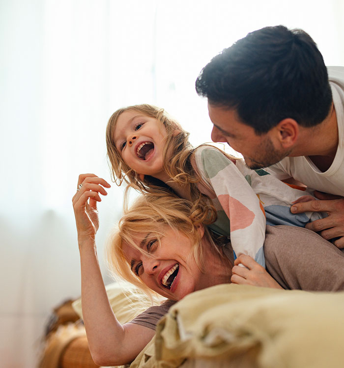 Young family playing in their home