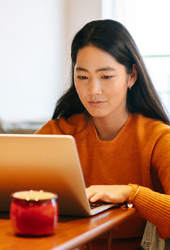 Young woman using her laptop computer