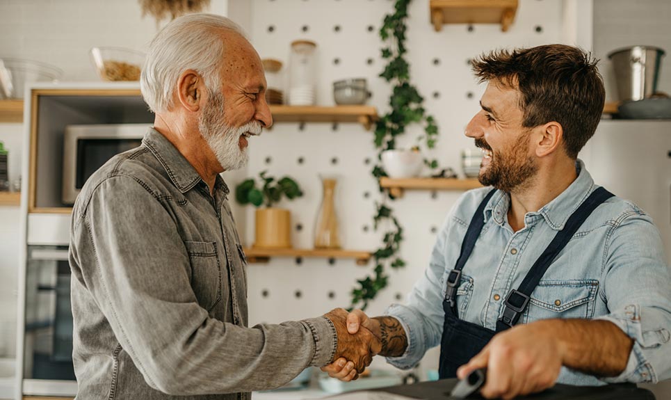 A small business owner meeting with a client