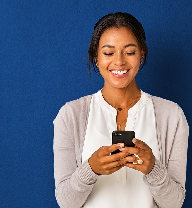 A woman looking at a cell phone.